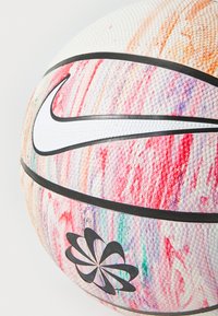 Nike basketball featuring a textured design with colorful brush strokes in pink, orange, and blue, accented by a black logo and stripes.