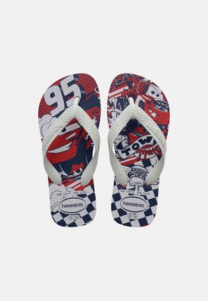 Children’s flip-flops with red, white, and blue Cars movie design, white straps, and size markings on a plain background.