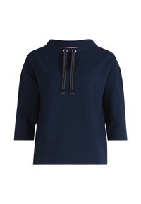 Sudadera de color azul marino con un cuello alto, mangas tres cuartos y cordones de contraste con acentos plateados. Textura suave.