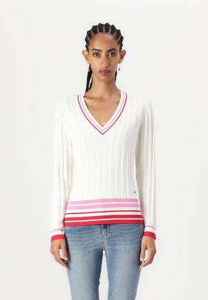 White ribbed sweater with a V-neck, featuring red, pink, and white striped accents along the hem and sleeve cuffs. Soft knit texture.