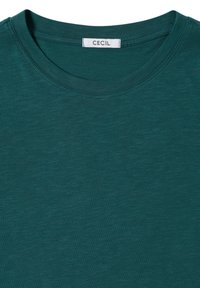 Turbukowy t-shirt z okrągłym dekoltem od CECIL, wykonany z teksturowanej tkaniny z delikatnymi różnicami w kolorze. Miękkie, krótkie rękawy. Metka umieszczona przy dekolcie.