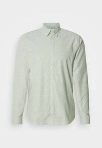 Παντελόνι με κουμπιά σε ανοιχτό πράσινο χρώμα, με γιακά, υφασμένο ύφασμα με υφή και διακριτική ραφή στο μπροστινό μέρος και τις μανσέτες.