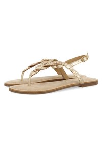 Sandali piatti dorati con cinturini intrecciati, dotati di design con toe post e cinturino alla caviglia. Soletta in morbido suede e suola in gomma leggera.