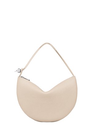 Beige crescent-shaped handbag with a textured surface, slender handle, and a zip closure accented by metallic hardware.