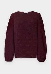 Top a maniche lunghe color bordeaux con motivo floreale testurizzato e in rilievo. Scollatura rotonda e polsini arricciati. Tessuto morbido con leggera lucentezza.