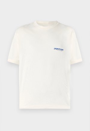 Kremfarget t-skjorte med kort erm laget av myk bomull, med en liten blå trykt logo på venstre brystsone. Klassisk rund hals-design.