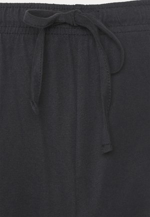 Sorte sweatpants med elastisk talje og snøre. Glat tekstur, enkelt design og ingen synlige mønstre eller detaljer.