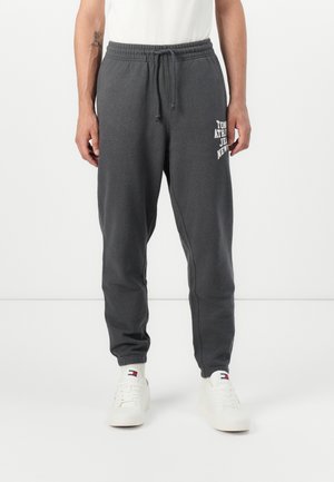 ARCH VARSITY - Tracksuit bottoms - washed black