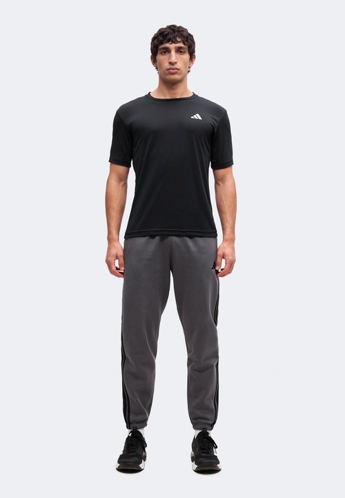 adidas ESSENTIALS 3 STRIPES TAPERED CUFFED PANTS - Tracksuit bottoms - grey five/black — foto 2