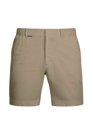 Beige shorts made from textured fabric with a flat front, elastic waistband, and side pockets. Features a small brand logo on the waistband.
