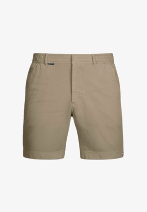 Shorts beiges en tissu texturé avec un devant plat, une ceinture élastique et des poches latérales. Présente un petit logo de la marque sur la ceinture.