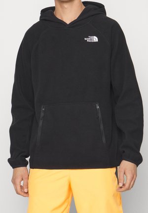 Czarna bluza polarowa z kapturem, z przednią kieszenią z zamkiem błyskawicznym, rękawami raglanowymi oraz logo na lewej piersi.