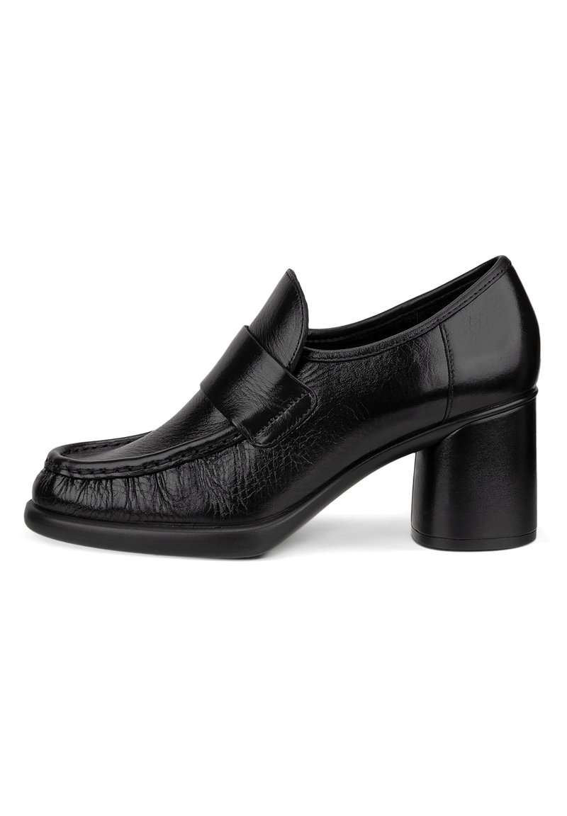 Sorte skinnblokk-heel sko med rund tå og dekorativ stropp. Teksturert overdel med broderidetaljer og glatt, blank finish.