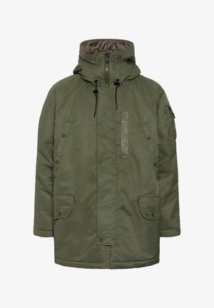 Olivgrüne gepolsterte Jacke mit Kapuze, zwei vorderen Taschen und einer mit Reißverschluss versehenen Brusttasche. Verfügt über elastische Kordeln und ein weiches Innenfutter.