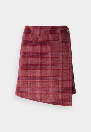 Red plaid miniskirt with a textured wool blend. Features a wrap design and a silver accent detail at the waist.