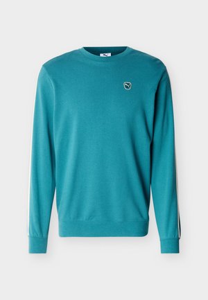 Teal long-sleeve crewneck sweatshirt with ribbed cuffs, a small white Puma logo on the left chest, and white stripes along the sleeves.