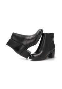 Botas de cuero negro hasta el tobillo con punta redonda, tacón de bloque de altura media, cremallera lateral y textura suave. Presenta detalles de costura mínimos.