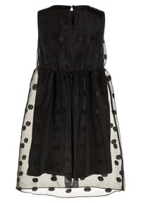 Svart ärmlös klänning med genomskinligt prickigt overlay, insvängd midja och nyckelhålsdetalj vid nackens baksida.