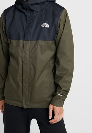 Water-resistant jacket with a black upper section and olive green lower section. Features a hood, zippered pockets, and logo detail.