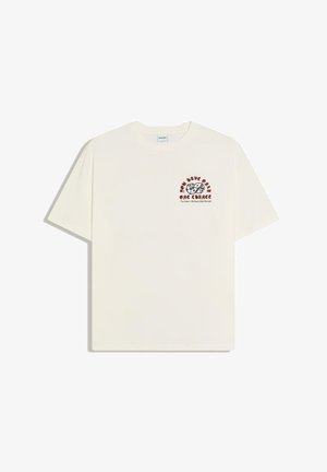 Offwhite kortærmet t-shirt med terningegrafik og teksten "Du har kun én chance" på øverste venstre bryst.