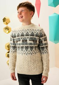 Knit sweater featuring a cream base, grey and brown geometric patterns, and textured cable knit at the lower section. Long sleeves and crew neck.