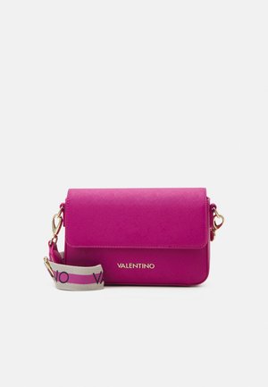 Bright pink Valentino crossbody bag with textured finish, gold-tone hardware, and detachable beige strap with pink stripe and black logo.