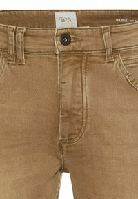 Slim-fit beige denim broeken met een knoopsluiting, vijf zakken en zichtbare stikseldetails. De stof voelt zacht en glad aan.
