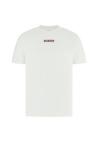 T-shirt bianca a maniche corte in cotone, con il logo rosso "GUESS" al centro sul davanti. Design classico con scollo a girocollo.