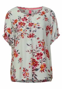 Blommig blus i ljusgrön tyg med röda, rosa och marinblå blommor. Korta ärmar med elastiska muddar, knäppning fram och en avslappnad passform.