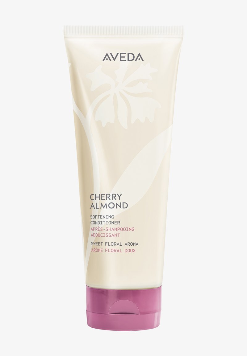Aveda Cherry Almond weichmachende Conditioner-Tube mit violettem Deckel, florales Design und Text, der süßes florales Aroma in Englisch und Französisch beschreibt.