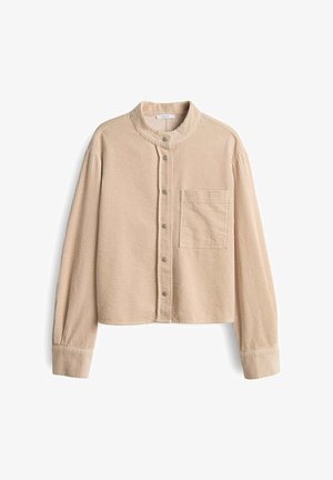 Beige Cord-Hemd mit hohem Kragen, Knopfverschluss und einer Brusttasche. Verfügbar mit strukturiertem, geripptem Stoff und langen Ärmeln.