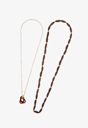Złoty naszyjnik z brązowym zawieszką z żywicy oraz drugi naszyjnik z owalnymi, ciemnobrązowymi koralikami z złotymi akcentami.