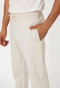 Guess MID WAIST JOGGING - Pantaloni sportivi - beige