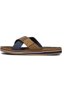Brown and navy slide sandal with cross straps, featuring a textile upper and contrasting white and navy sole accents. Textured detailing present.