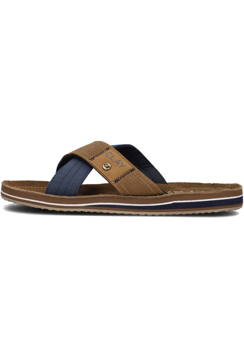 Brown and navy slide sandal with cross straps, featuring a textile upper and contrasting white and navy sole accents. Textured detailing present.