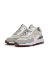 Gray and white sneakers with mesh and suede materials. Features textured laces, a cushioned sole, and rubber traction bottom.