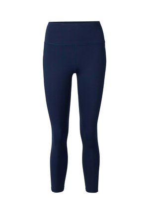 Leggings ajustés taille haute bleu marine avec coutures plates, s'étendant jusqu'à la cheville, conçus pour une utilisation sportive ou décontractée.