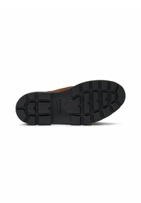 Suola di scarpa in gomma nera con un motivo di presa testurizzato e nome del marchio in rilievo. Materiale superiore marrone chiaro parzialmente visibile al tallone.