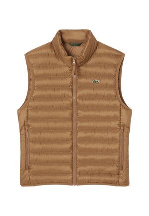 Tan padded vest with high collar, centered zipper closure, and two side zippered pockets; features a small green logo on the left chest.