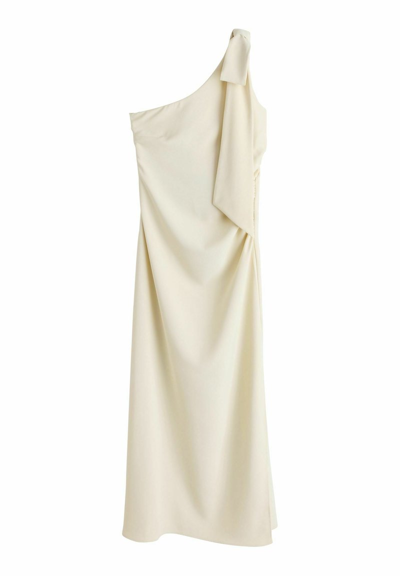 Asymmetrische jurk met één schouder in crèmekleurige stof. Heeft een gedrapeerd ontwerp en een knoopdetail op de schouder, waardoor zachte plooien ontstaan.