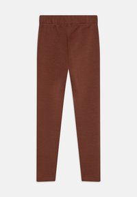 Brune leggings med en jevn tekstur, elastisk midje, smal passform og uten ekstra mønstre eller detaljer i maskinvarer.