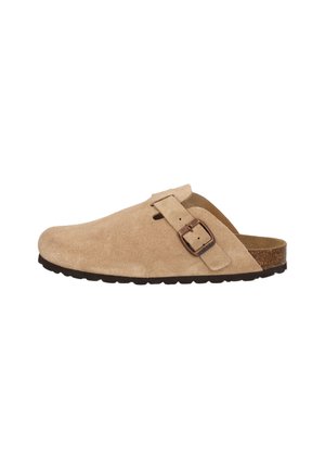 Beige suede clogs with a rounded toe, adjustable buckle strap, and contoured cork sole. Textured surface and rubber outsole for grip.