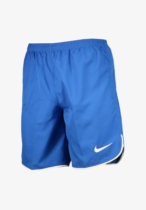 Blå sportshorts i lättviktig tyg, med resårmidja och en vit Nike-logga. Utsmyckad med vit kant vid fållen.