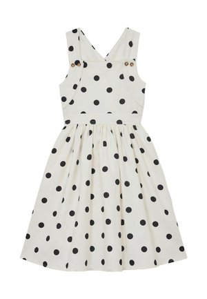 Vestido blanco sin mangas con lunares negros, tirantes con botones y falda fruncida.