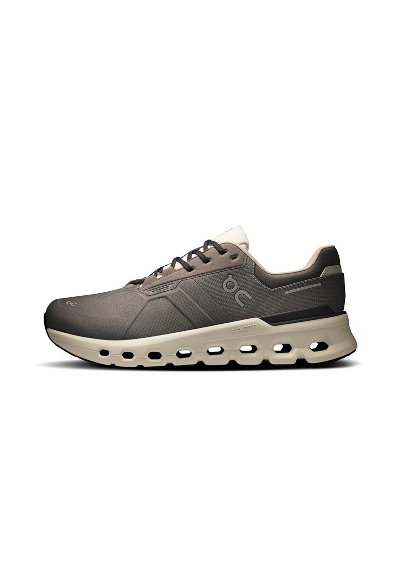 Męskie buty do biegania z szarym wierzchem, teksturowanym materiałem, kremową podeszwą środkową oraz wentylowaną podeszwą zewnętrzną z wycięciami dla lepszego amortyzowania.