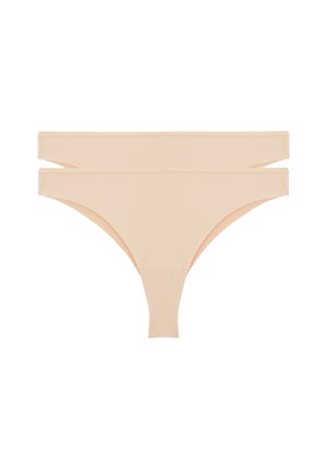 Deux strings beiges sans couture pour femmes empilés sur un fond blanc, montrant la vue de face avec une large ceinture.