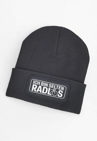 Black knitted beanie with a ribbed texture, featuring a white rectangular patch with the text “ICH BIN SELTEN RADLOS” and a bicycle graphic.