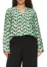 Langärmlige Bluse mit geometrischem Muster in den Farben Grün, Schwarz und Grau. V-Ausschnitt-Design mit lockerer Passform und strukturiertem Stoff.