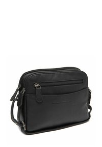 Borsa a tracolla in pelle nera con due compartimenti con zip, tracolla regolabile e superficie liscia. Presenta il marchio sul davanti.
