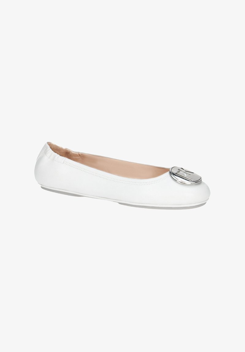 White leather ballet flats with a round toe, featuring a large metallic accent on the front and a soft pink lining.